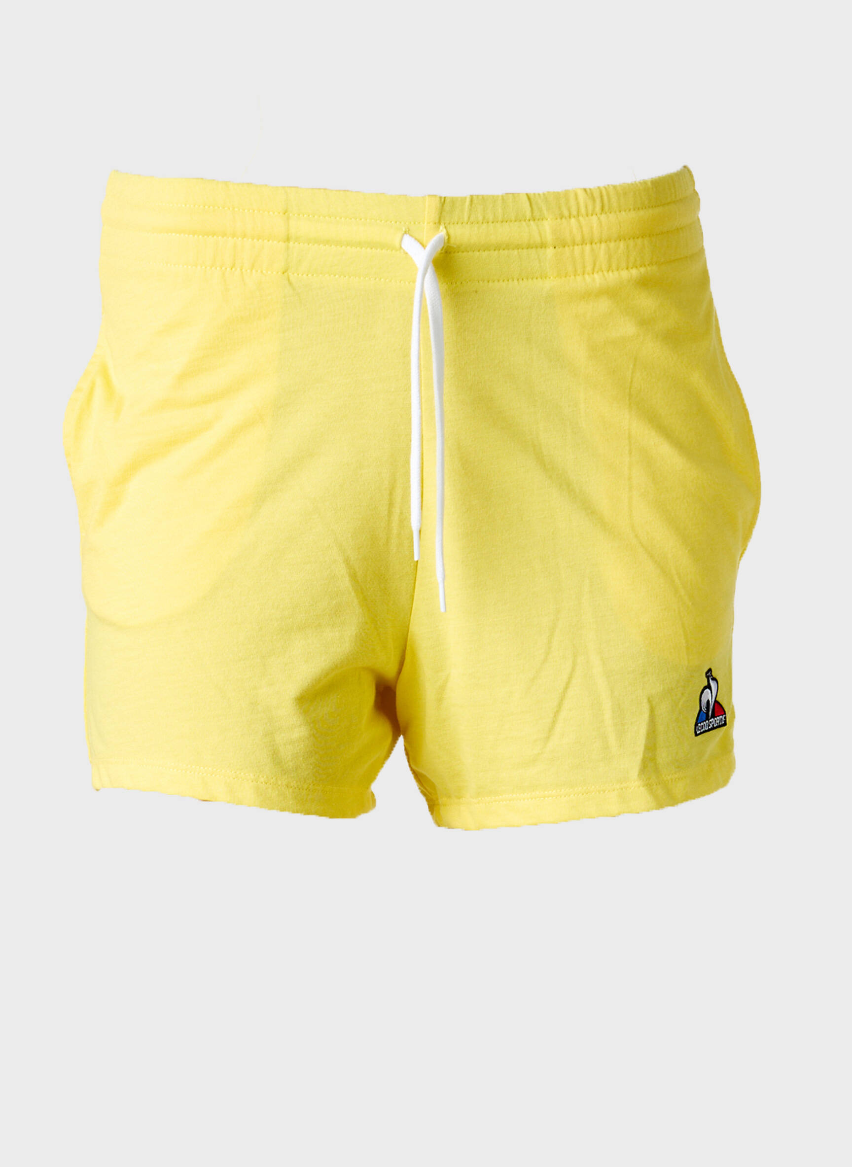 Šortas popelinos audinys, kuris pasižymi lygiu ir tankiu paviršiumi. elastinė dydis geltona LE COQ SPORTIF berniukas